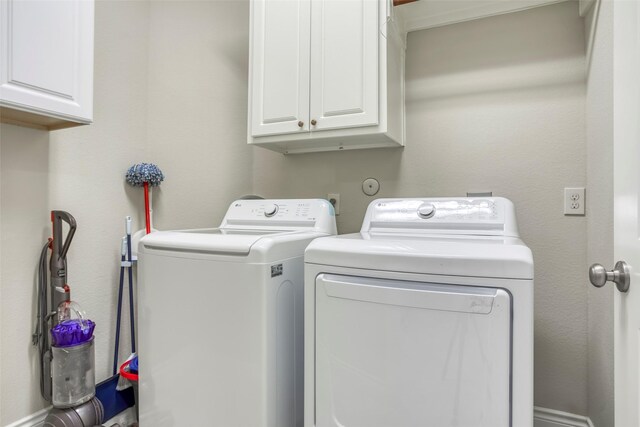 29114 Davenport Dr, Katy, TX 77494 - washroom featuring washing machine and clothes dryer and cabinet space