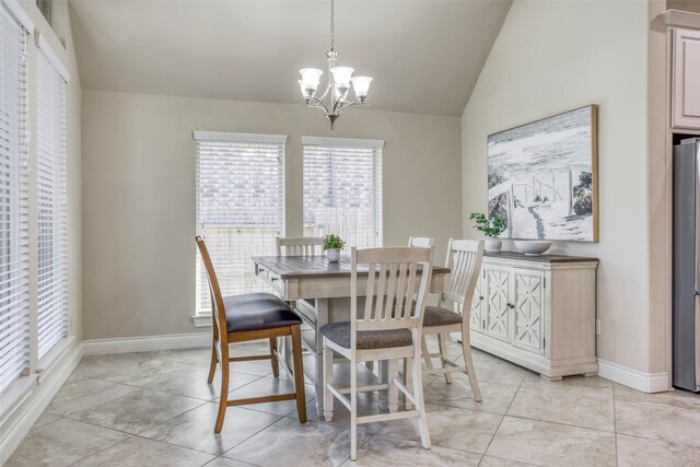 29114 Davenport Dr, Katy, TX 77494 - dining room featuring a chandelier, vaulted ceiling, and light tile patterned floors