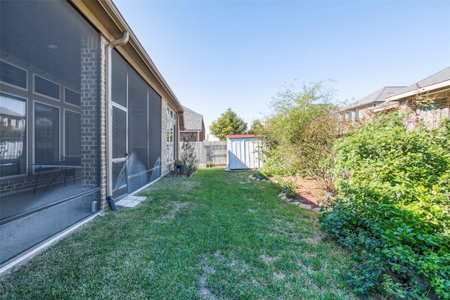 29114 Davenport Dr, Katy, TX 77494 - fenced backyard featuring a storage unit and a sunroom