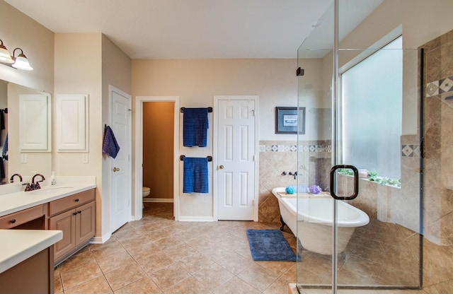 20303 Misty River Way, Cypress, TX 77433 - full bath with vanity, a freestanding tub, a shower stall, and tile patterned floors
