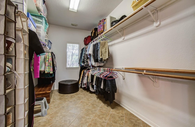 20303 Misty River Way, Cypress, TX 77433 - walk in closet featuring light tile patterned floors