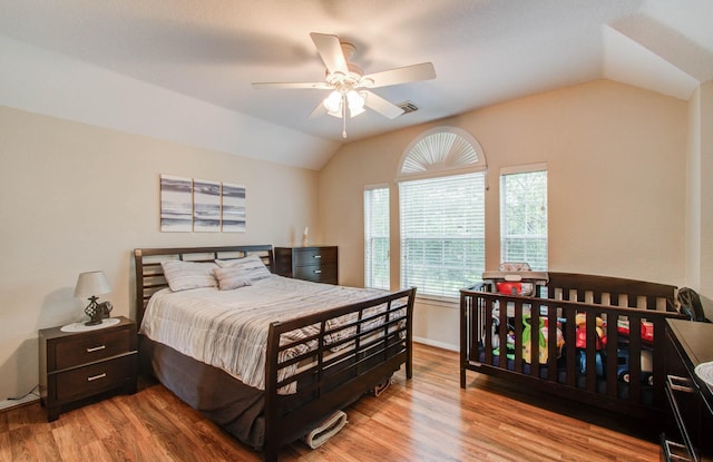 20303 Misty River Way, Cypress, TX 77433 - bedroom with vaulted ceiling, wood finished floors, and ceiling fan