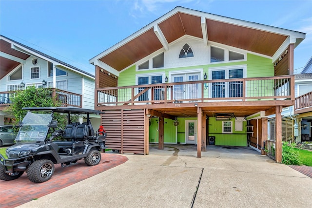 902 Grove Rd, Clear Lake Shores, TX 77565 - view of front of house featuring a carport and driveway