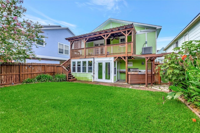 902 Grove Rd, Clear Lake Shores, TX 77565 - back of property with a hot tub, stairway, french doors, and a wooden deck