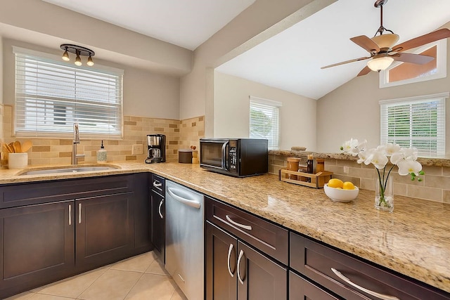 902 Grove Rd, Clear Lake Shores, TX 77565 - kitchen with black microwave, dishwasher, tasteful backsplash, light stone countertops, and lofted ceiling