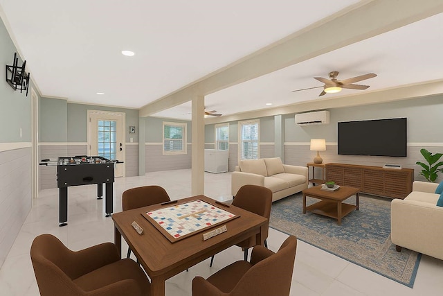902 Grove Rd, Clear Lake Shores, TX 77565 - living room featuring a wall mounted AC, a wainscoted wall, a ceiling fan, healthy amount of natural light, and tile patterned flooring