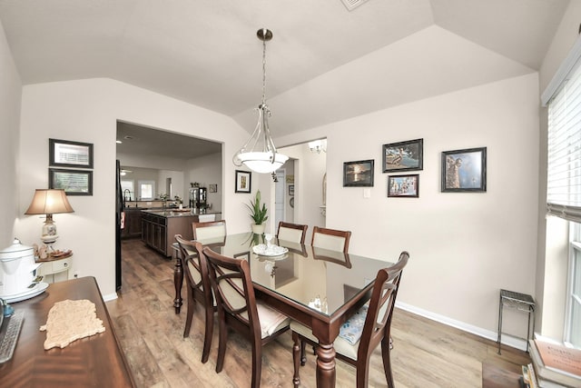 32726 Timber Point Dr, Brookshire, TX 77423 - dining room featuring lofted ceiling and light wood finished floors