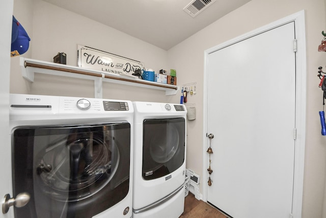 32726 Timber Point Dr, Brookshire, TX 77423 - washroom with washing machine and clothes dryer and wood finished floors