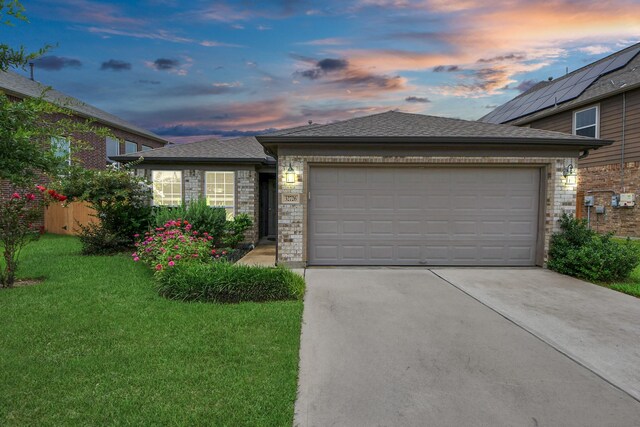 32726 Timber Point Dr, Brookshire, TX 77423 - view of front facade featuring concrete driveway, a garage, a front yard, brick siding, and roof with shingles
