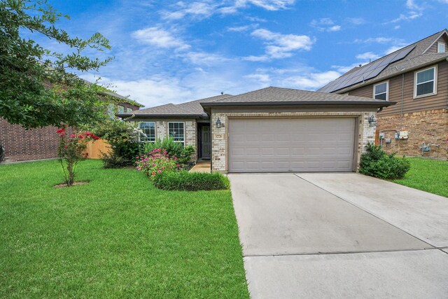 32726 Timber Point Dr, Brookshire, TX 77423 - view of front of home with driveway, a front yard, an attached garage, brick siding, and a shingled roof
