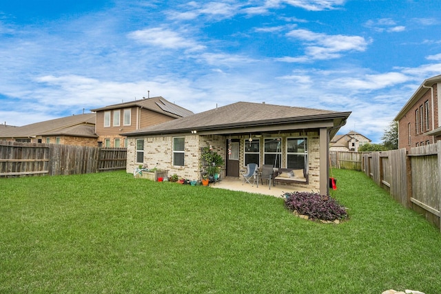 32726 Timber Point Dr, Brookshire, TX 77423 - back of house featuring brick siding, a patio, a fenced backyard, and roof with shingles