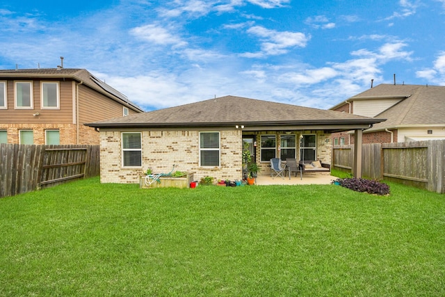 32726 Timber Point Dr, Brookshire, TX 77423 - rear view of house with brick siding, a patio, a fenced backyard, and a shingled roof