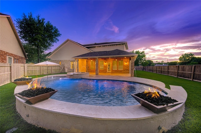 18511 Yellowstone Trl, Humble, TX 77346 - view of swimming pool with a fire pit, a fenced backyard, a pool with connected hot tub, and a patio area