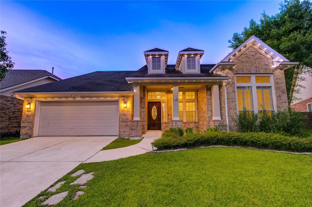 18511 Yellowstone Trl, Humble, TX 77346 - craftsman-style house featuring brick siding, a lawn, driveway, and a garage