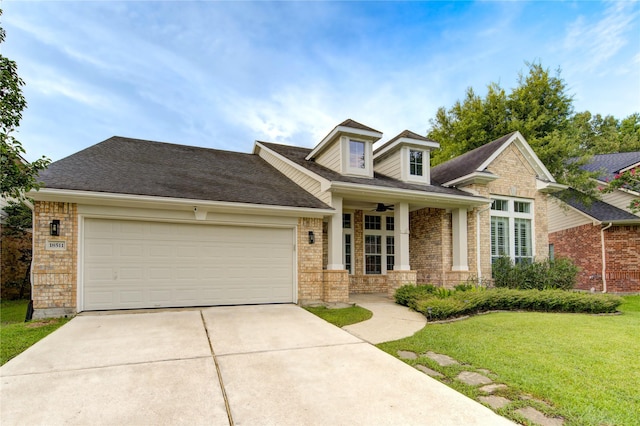 18511 Yellowstone Trl, Humble, TX 77346 - view of front of house featuring driveway, a front lawn, brick siding, and a garage