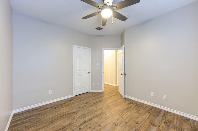 18511 Yellowstone Trl, Humble, TX 77346 - unfurnished bedroom featuring wood finished floors and ceiling fan