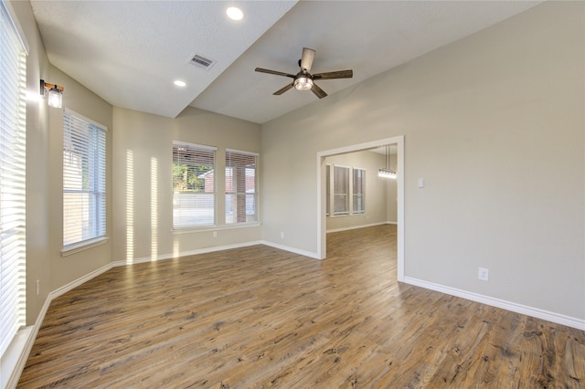 18511 Yellowstone Trl, Humble, TX 77346 - spare room with vaulted ceiling, ceiling fan, wood finished floors, and recessed lighting