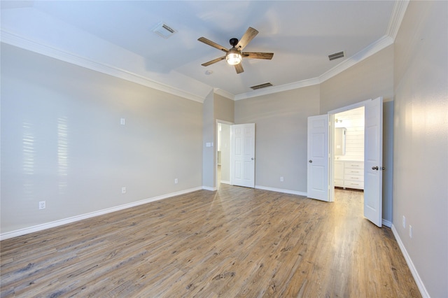 18511 Yellowstone Trl, Humble, TX 77346 - unfurnished bedroom with crown molding, light wood-style flooring, connected bathroom, and a ceiling fan