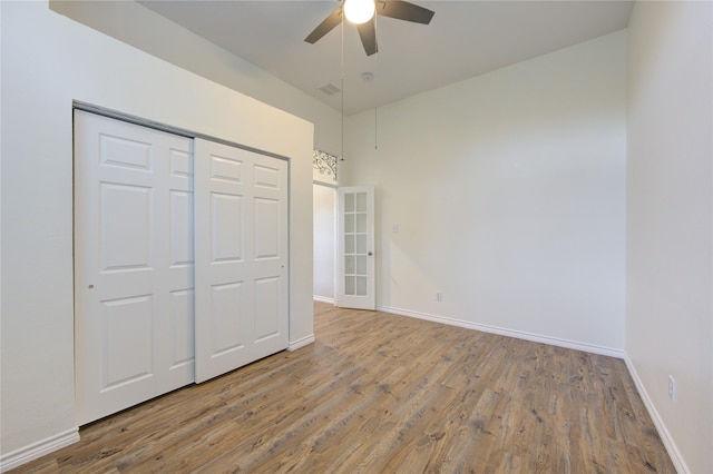 18511 Yellowstone Trl, Humble, TX 77346 - unfurnished bedroom featuring wood finished floors, a closet, and ceiling fan