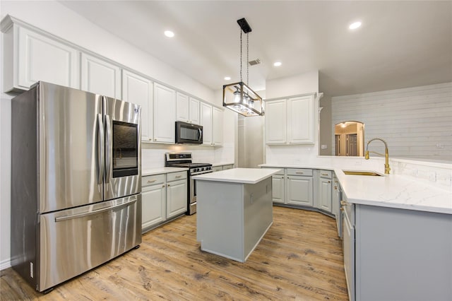 18511 Yellowstone Trl, Humble, TX 77346 - kitchen with appliances with stainless steel finishes, backsplash, gray cabinets, recessed lighting, and light wood-type flooring