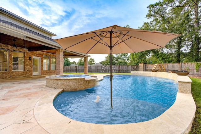 18511 Yellowstone Trl, Humble, TX 77346 - view of swimming pool featuring a fenced backyard, a pool with connected hot tub, and a patio