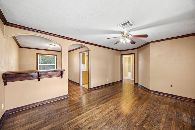 5419 Firefly Ave, Houston, TX 77017 - unfurnished room featuring wood finished floors, ceiling fan, arched walkways, a textured ceiling, and ornamental molding
