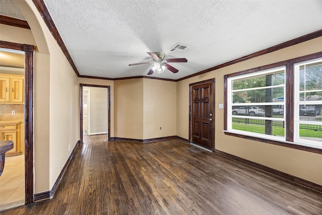 5419 Firefly Ave, Houston, TX 77017 - entrance foyer with a ceiling fan, wood finished floors, a textured ceiling, and crown molding
