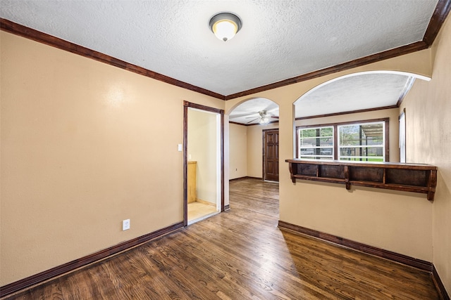 5419 Firefly Ave, Houston, TX 77017 - unfurnished room with wood finished floors, a textured ceiling, arched walkways, a ceiling fan, and crown molding