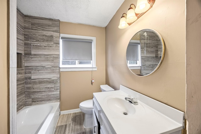 5419 Firefly Ave, Houston, TX 77017 - full bath featuring vanity, wood finished floors, a textured ceiling, and bathtub / shower combination