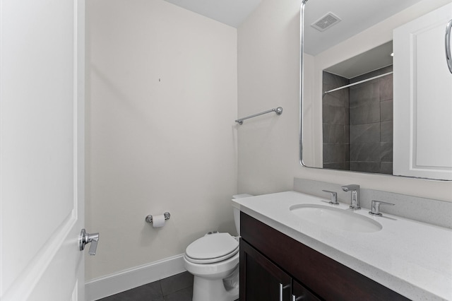 9635 Riddlewood Ln, Houston, TX 77025 - bathroom featuring vanity, tile patterned floors, and a tile shower