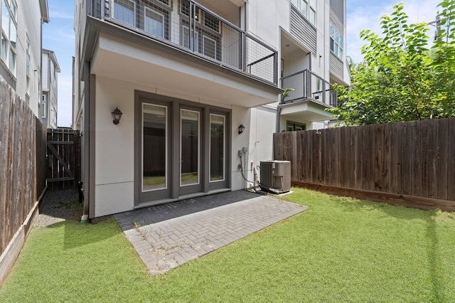 9635 Riddlewood Ln, Houston, TX 77025 - rear view of property with stucco siding, a fenced backyard, and a patio