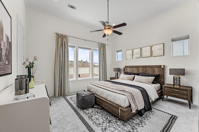 9635 Riddlewood Ln, Houston, TX 77025 - bedroom featuring light colored carpet, ornamental molding, and a ceiling fan