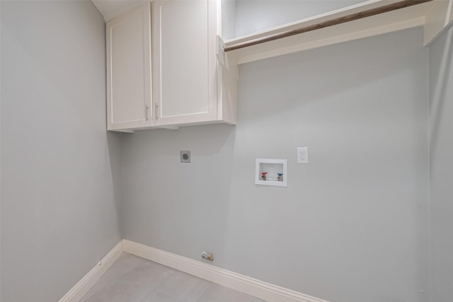 4414 Lemac Dr, Houston, TX 77096 - washroom featuring hookup for an electric dryer, hookup for a washing machine, cabinet space, hookup for a gas dryer, and light tile patterned floors