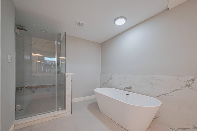 4414 Lemac Dr, Houston, TX 77096 - bathroom featuring a freestanding bath, a shower stall, and a wainscoted wall