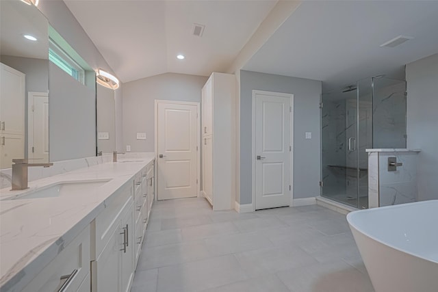4414 Lemac Dr, Houston, TX 77096 - bathroom with a marble finish shower, double vanity, a soaking tub, vaulted ceiling, and recessed lighting