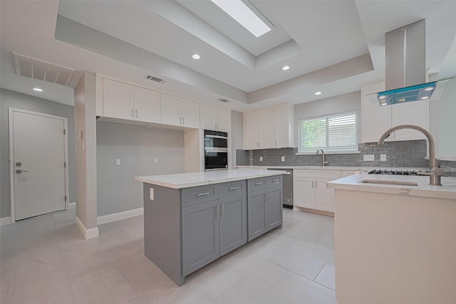 4414 Lemac Dr, Houston, TX 77096 - kitchen with dishwasher, gray cabinetry, decorative backsplash, a raised ceiling, and white cabinetry