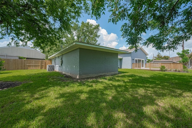 4414 Lemac Dr, Houston, TX 77096 - back of property featuring brick siding and a deck