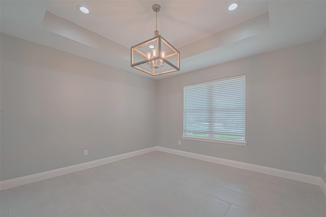 4414 Lemac Dr, Houston, TX 77096 - tiled spare room featuring a chandelier, a raised ceiling, and recessed lighting
