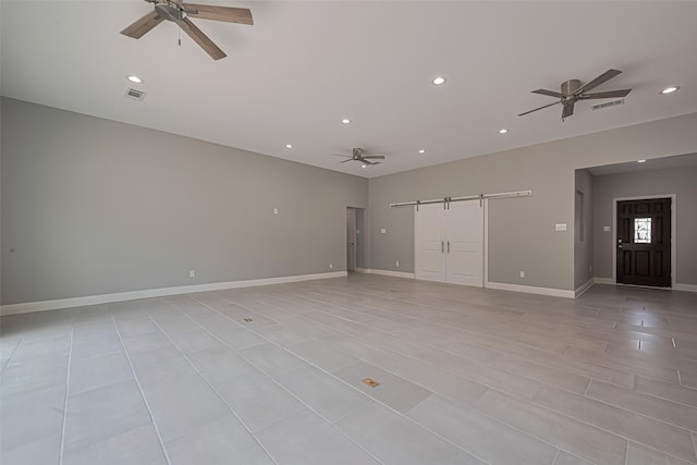 4414 Lemac Dr, Houston, TX 77096 - unfurnished living room with a barn door, ceiling fan, and recessed lighting