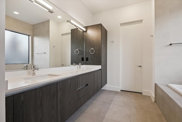 2014 Colquitt, Houston, TX 77098 - bathroom featuring tile patterned floors, double vanity, tiled tub, and recessed lighting