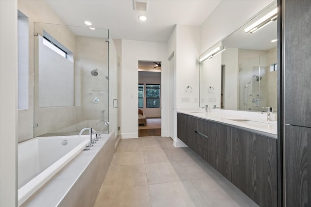 2014 Colquitt, Houston, TX 77098 - ensuite bathroom with a stall shower, tile patterned floors, a bath, and double vanity