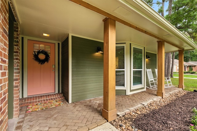 79 Fallshire Dr, The Woodlands, TX 77381 - property entrance featuring covered porch and brick siding