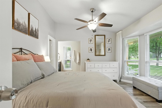 79 Fallshire Dr, The Woodlands, TX 77381 - bedroom with vaulted ceiling, wood finished floors, and ceiling fan