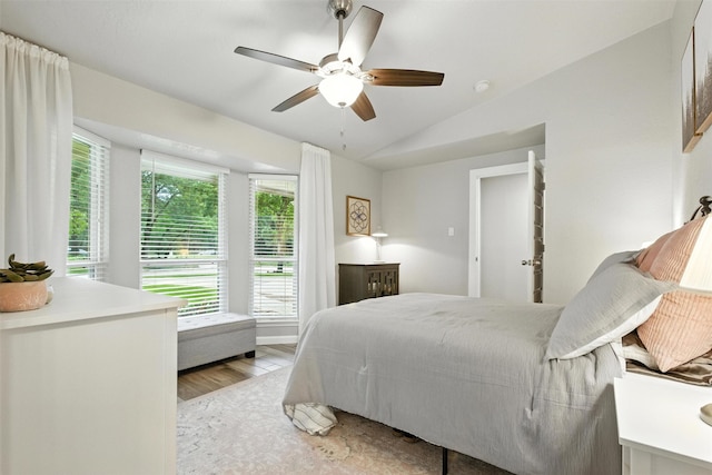 79 Fallshire Dr, The Woodlands, TX 77381 - bedroom featuring vaulted ceiling, light wood-type flooring, and ceiling fan