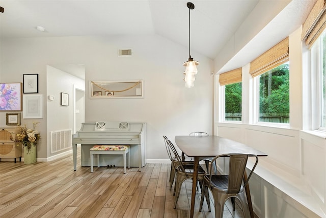 79 Fallshire Dr, The Woodlands, TX 77381 - dining room with light wood-type flooring and lofted ceiling