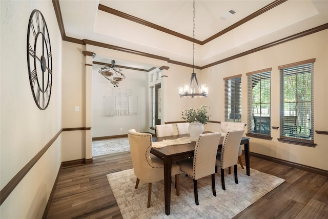 11399 Fm-3126, Livingston, TX 77351 - dining space featuring a chandelier, dark wood-style flooring, a raised ceiling, and crown molding