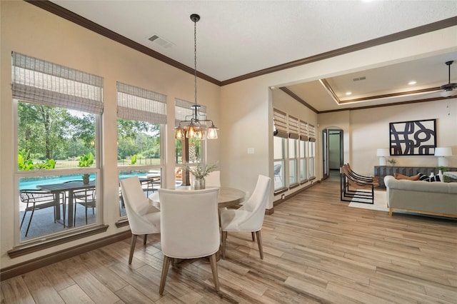 11399 Fm-3126, Livingston, TX 77351 - dining area with crown molding, light wood finished floors, arched walkways, a chandelier, and recessed lighting