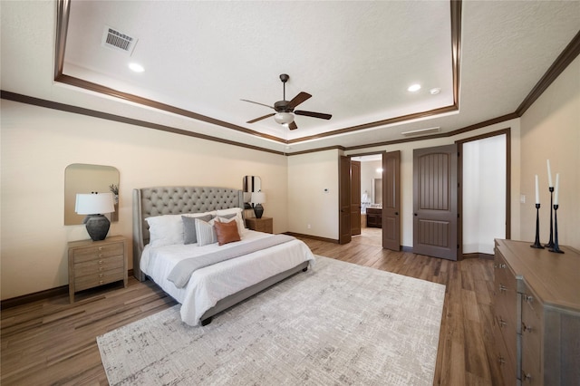11399 Fm-3126, Livingston, TX 77351 - bedroom with a tray ceiling, crown molding, wood finished floors, recessed lighting, and a ceiling fan