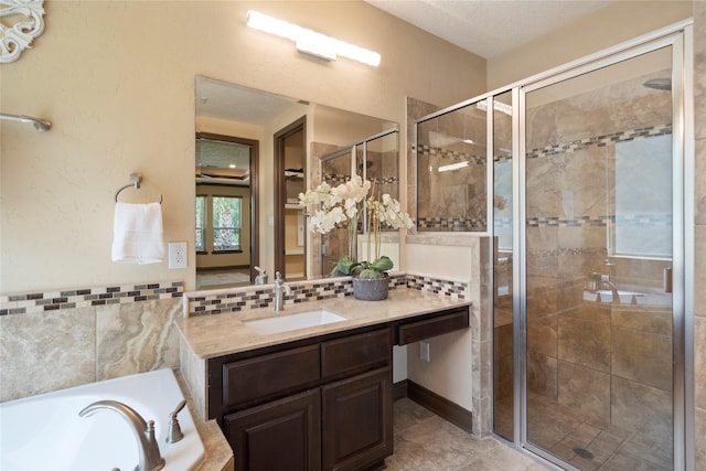 11399 Fm-3126, Livingston, TX 77351 - full bath with vanity, a shower stall, a garden tub, and tasteful backsplash