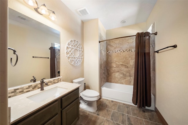 11399 Fm-3126, Livingston, TX 77351 - full bathroom featuring vanity, shower / tub combo, decorative backsplash, and stone finish floors